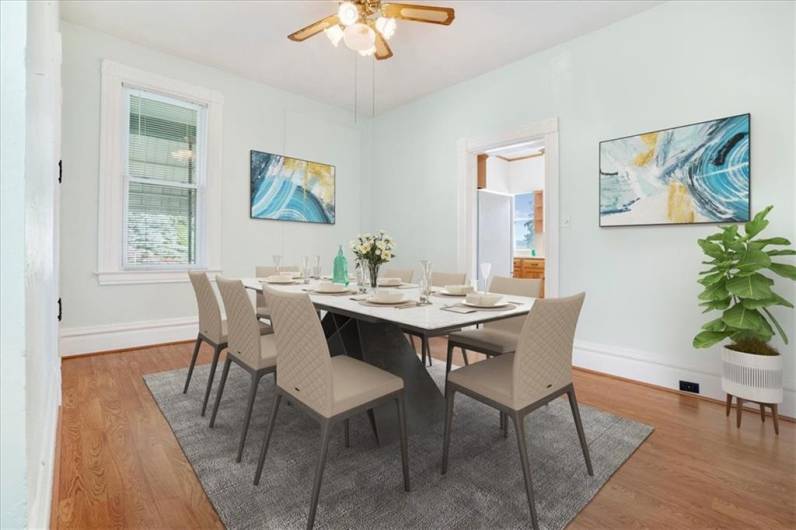 Dining room with built in cabinets and access to the kitchen and living room