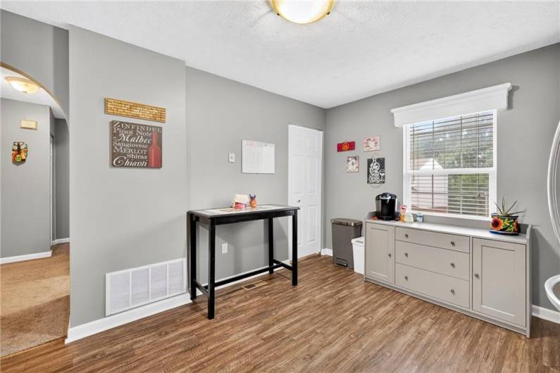 Here's another shot of the spacious kitchen.  The laundry room is behind the door in the corner.  The powder room is  discretely located in the hallway to the left