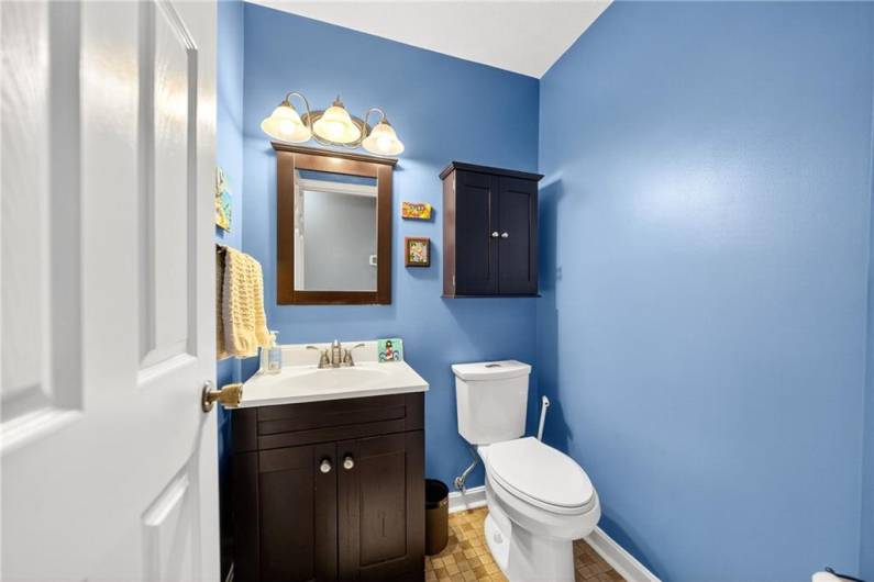 The convenient 1st floor powder room is discretely located off the main hallway.