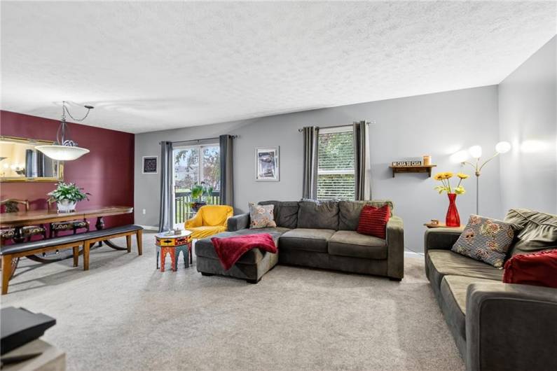 The spacious living room is open to the dining room!