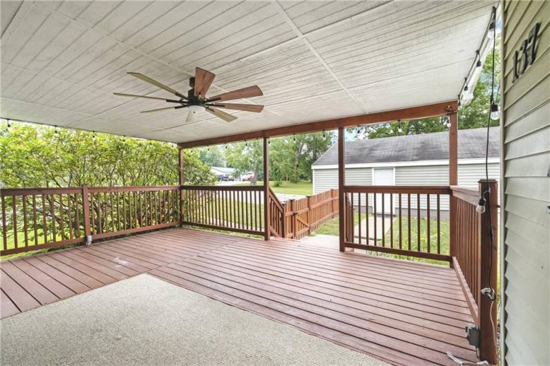 Step right off of the covered deck to the fenced yard and to the entrance to the garage**