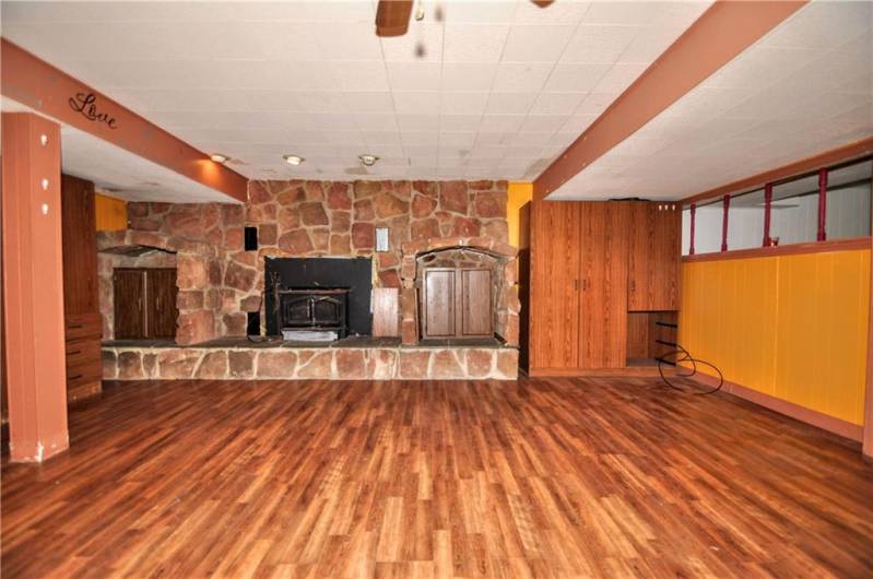 Wood Stove in Stone Fireplace in 20x16 Game Room