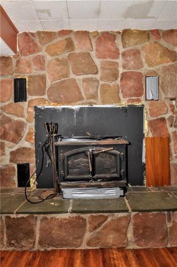 Stone Wood Burner Fireplace in Game Room
