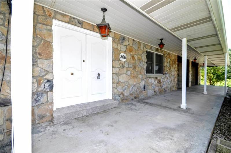 Covered Front Porch goes entire length of home