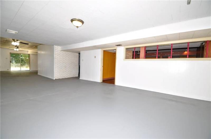 Huge Lower Level w/ So Many Possibilities! Could be a great Teen or In-law Suite or even possibility of making an Apartment w/ entrance from Sliding Glass Door