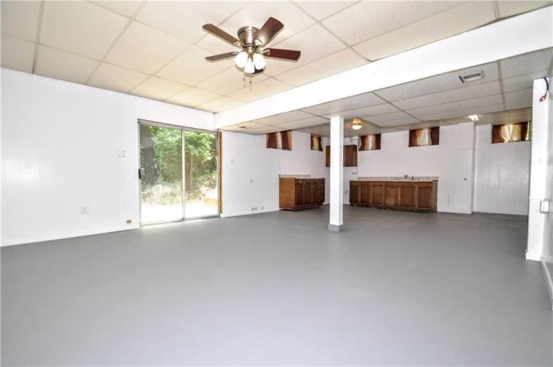 Another View of Gigantic Kitchen area in Lower Level & Sliding Glass Door to side yard.