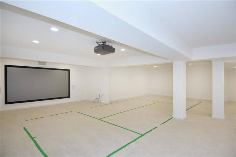 Gameroom with theater screen and projector
