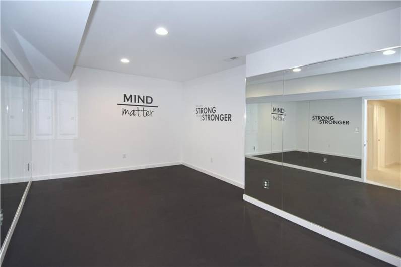 Work out room with rubber flooring.