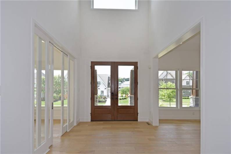 Greet family and friends in this lovely double door 2 story foyer.