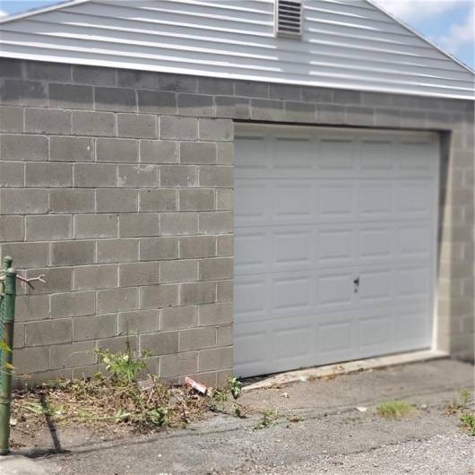 Over sized one car garage with plenty of room for storage, work shop, etc.