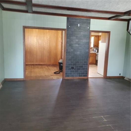 Living room is open to dining room and kitchen.