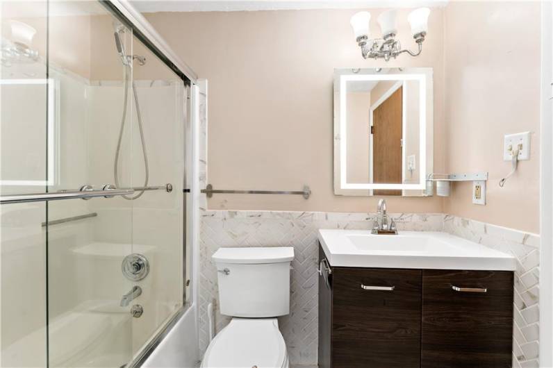 Upstairs Bathroom with Primary Bed and Second Bedroom Entrance