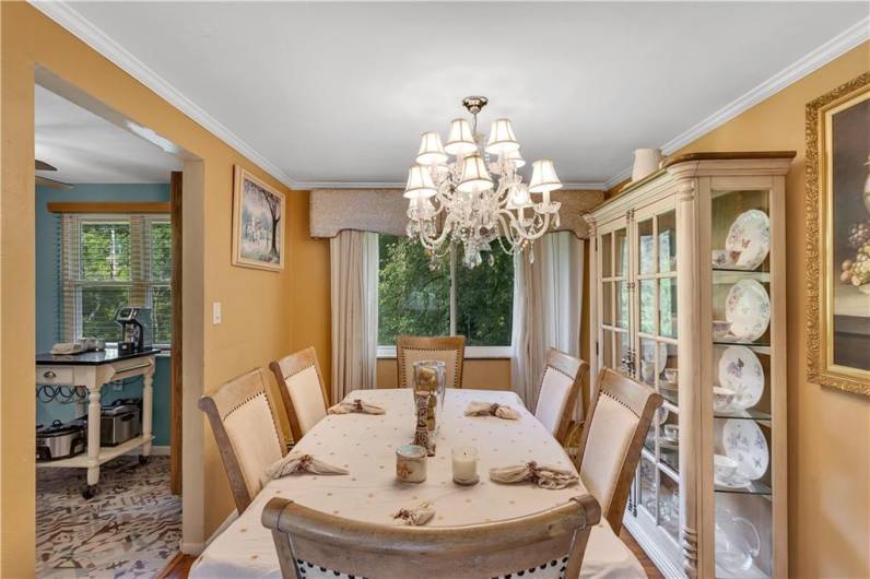 Formal dining room just off of Kitchen with wood flooring and crown molding