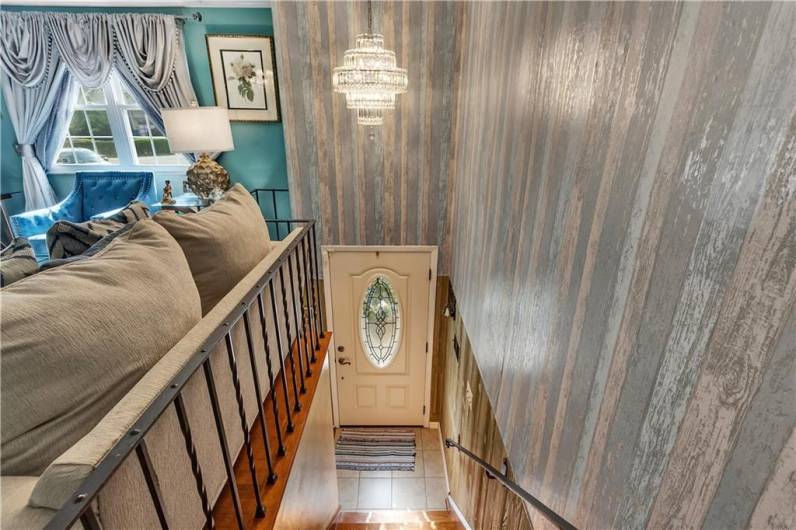 Entering thru front door.  A few steps up to main living area and a few steps down to lower level family/game room