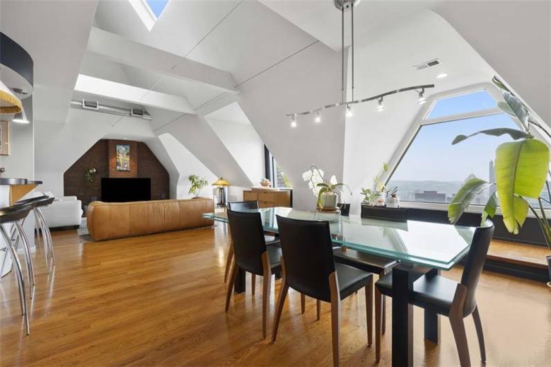 High vaulted ceilings and modern light fixtures amplify the bright and welcoming home