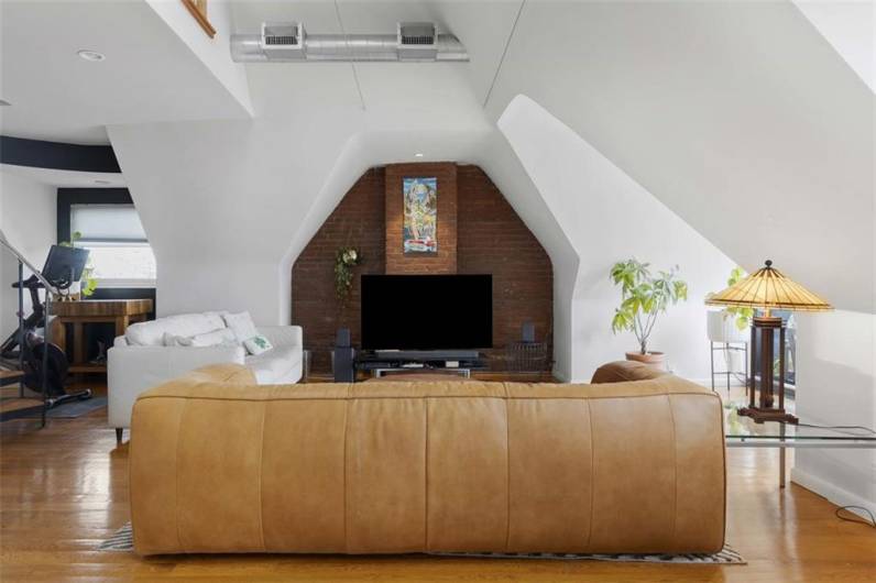 Living room with side nook for a workout or work from home space
