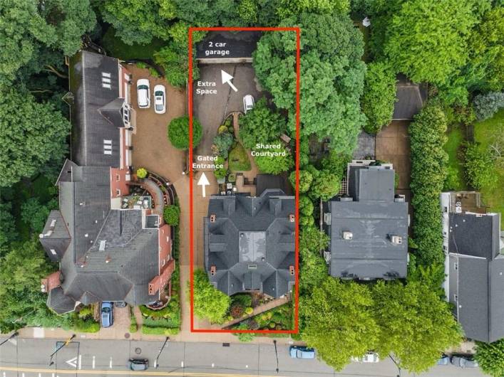 Aerial view of 229 Grandview Avenue showing the gated entrance, two car garage, parking area, and courtyard