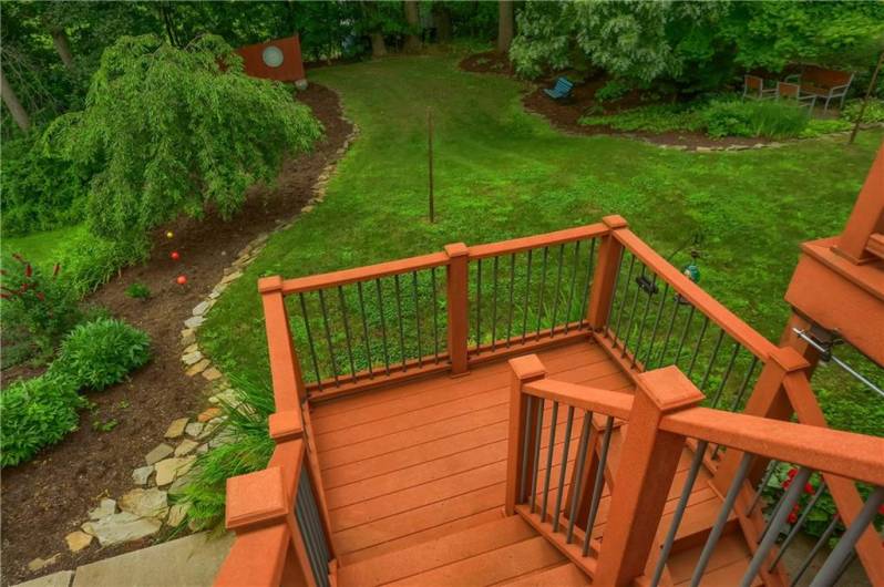Steps to yard from composite deck out of the kitchen.