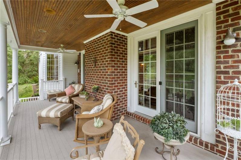 Located right off of the two-story family room, this deck not only offers a beautiful, peaceful view, but features a custom wood ceiling and two breezy ceiling fans for comfort.