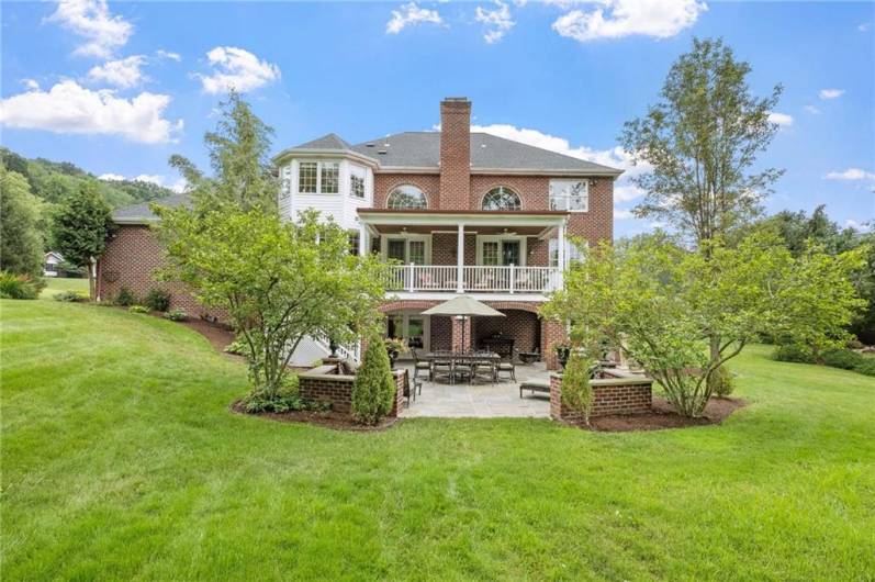 The front of the home is so beautiful, it's hard to believe that's rivaled by the stunning view of the back!