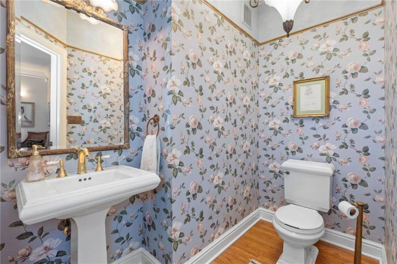 With an eye to design and detail, the first floor powder room isn't just convenient, it's beautiful!