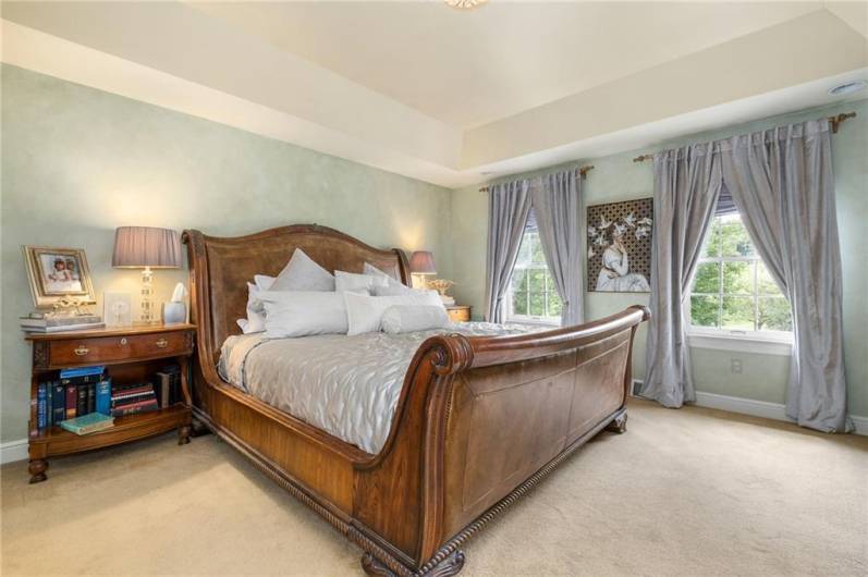The size of the primary bedroom allows for you to bring in your largest pieces of furniture and still have space.