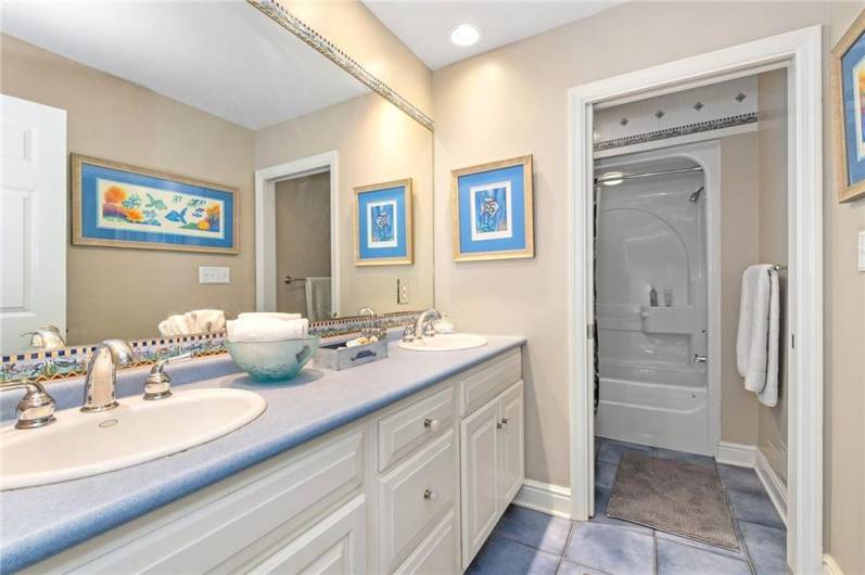 Second full bath upstairs features a double vanity and a separate water closet and shower area.