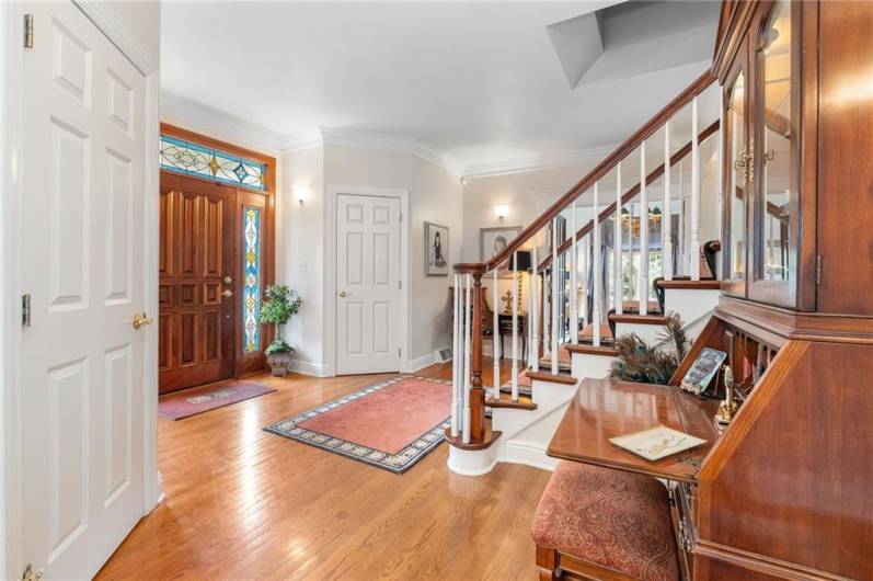 Immediately you are welcomed into the home by the warm, hues of the hardwood floors.