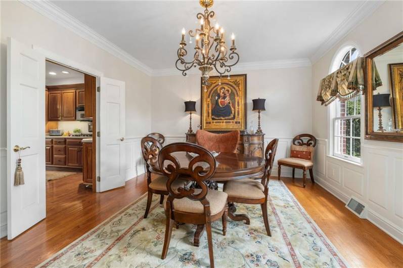The custom, three-piece crown molding and wainscoting take the dining room to the next level.