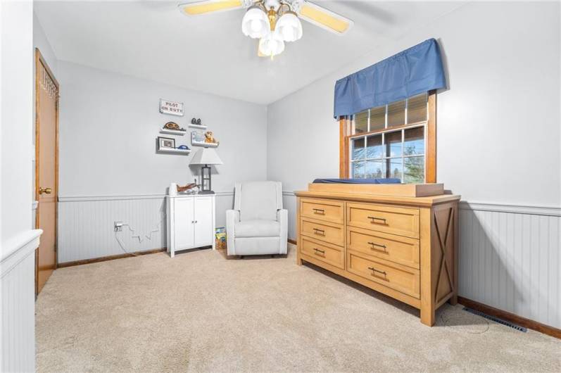 Alternate angle shows ceiling fan and layout flexibility—great for restful living or work-from-home setup.