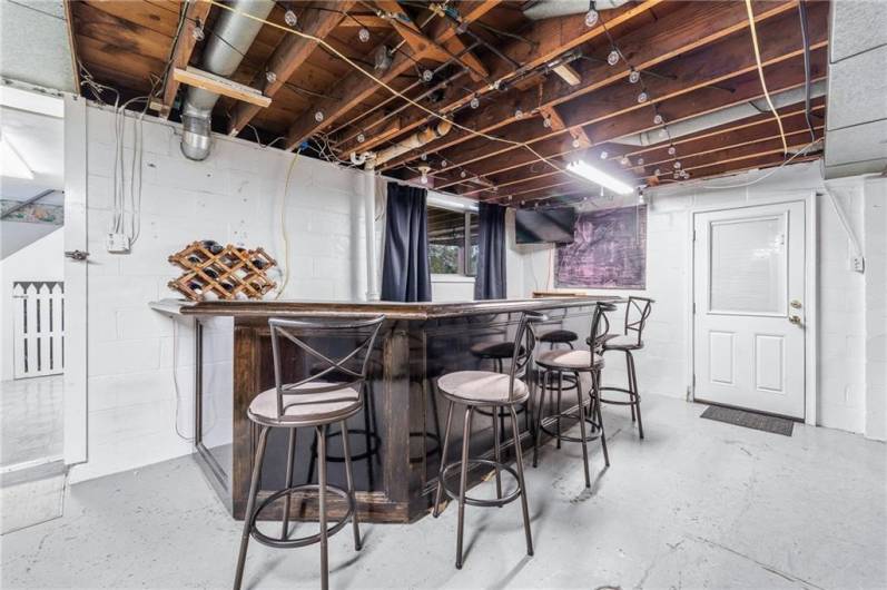 Expand your living space to the lower level gameroom with bar.