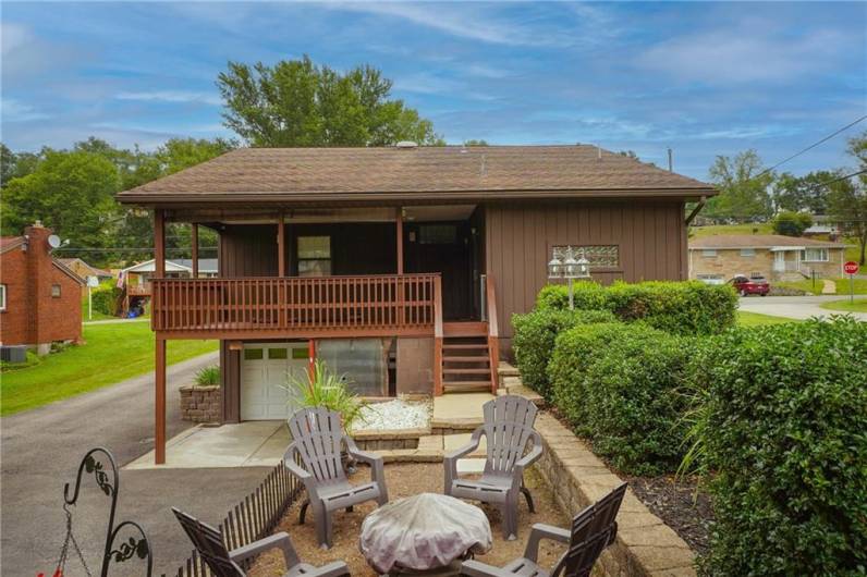 Private backyard retreat with fire pit and terraced landscaping—great for outdoor gatherings