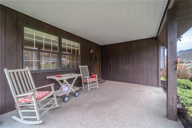 Spacious covered front porch with room for outdoor seating—perfect for enjoying your morning coffee or unwinding in the evening shade.