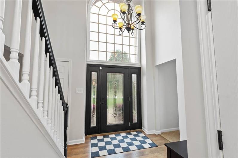 A stunning two storu entry withi a large palladium window for natural light.