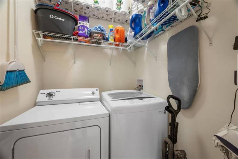 The laundry room sits just off of the kitchen for easy access.