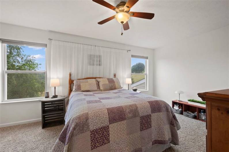 Step upstairs and find the large master bedroom that is flanked with 2 windows for natural light.
