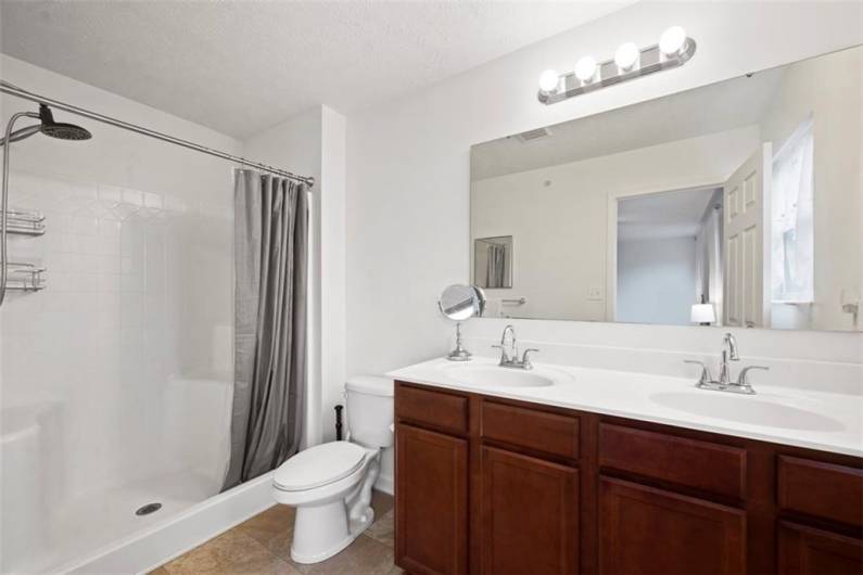 You will appreciate not only the dual vanity for the shared space but the step in shower for ease of getting in and out of the shower.