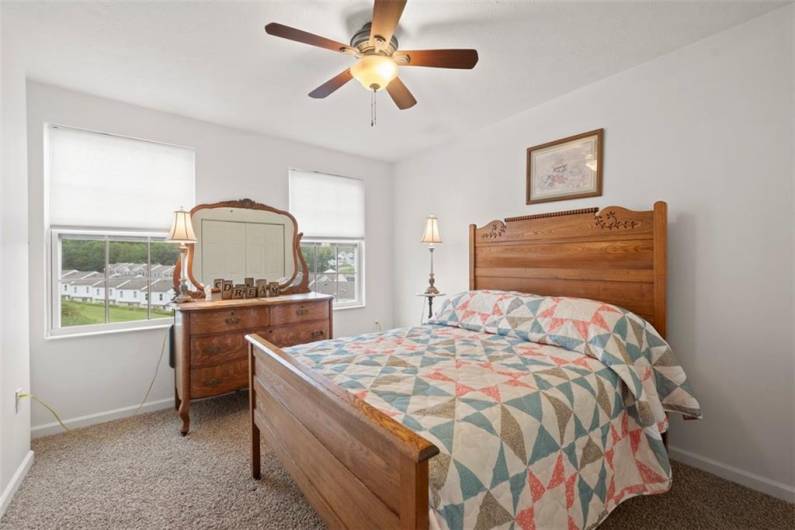 The second bedroom as well as the rest of the home is done in neutral tones.