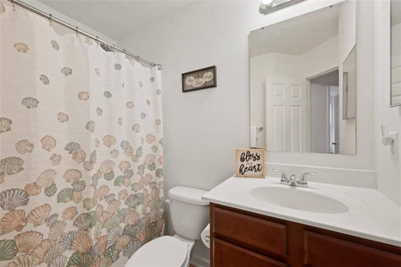 The second full guest bathroom has a tub/shower combo.
