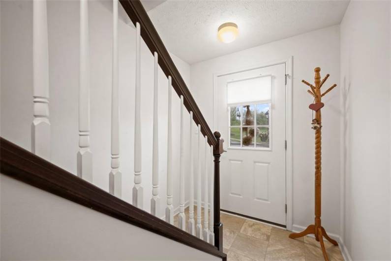 The entry leads to the garage or the front door.