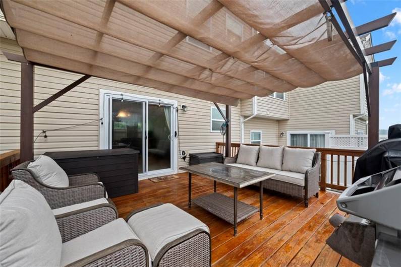 The amazing 16x16 deck with covered pergola is an extension of the townhouse.
