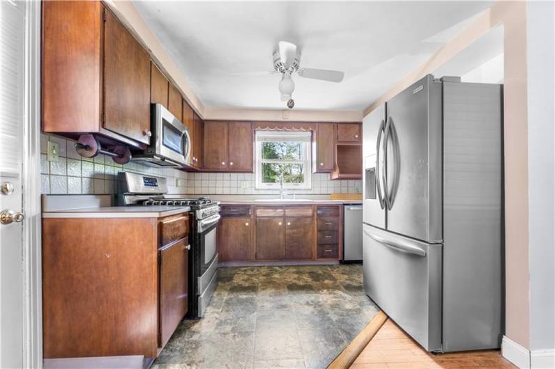 Kitchen is equipped with SS gas stove, Dishwasher, refrigerator, disposal and microwave.  Dishwasher and Refrigerator are 2 years old.