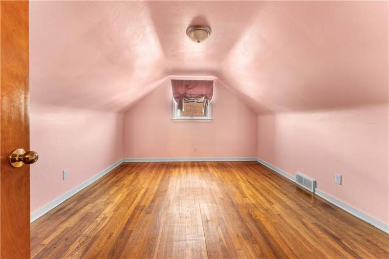 Second Floor Bedroom features hardwood floors.