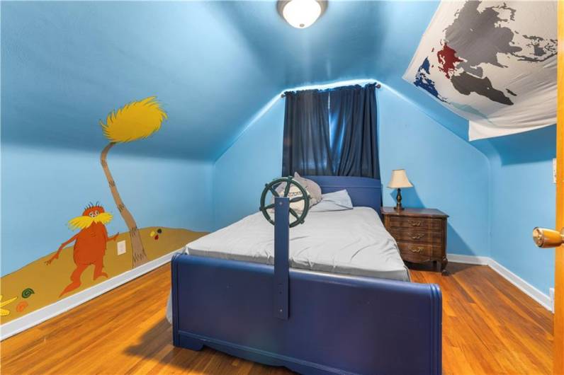 Third Bedroom is also located on the second floor, featuring hardwood floors.