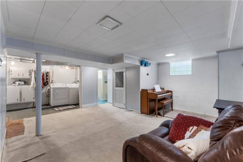 The basement features a partially finished game room, laundry and full bath.