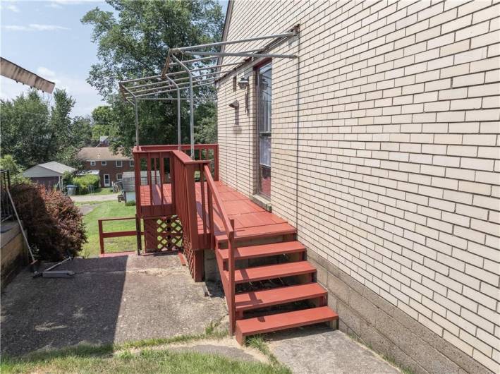 Porch size deck on side of home, right outside kitchen.  Perfect spot for a grill.