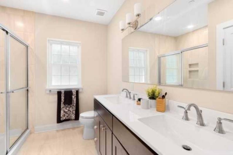 Owner's bath has double sinks, step in shower and closet.