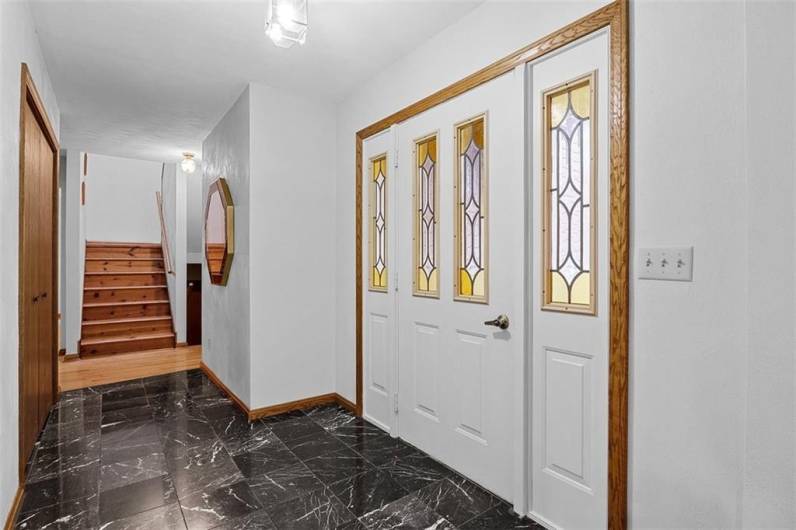 Front entry with marble flooring