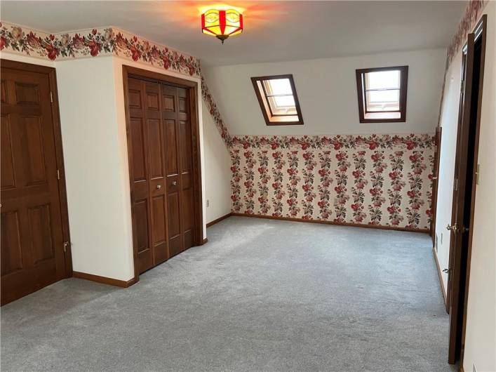 Spacious upstairs bedroom with lots of natural light