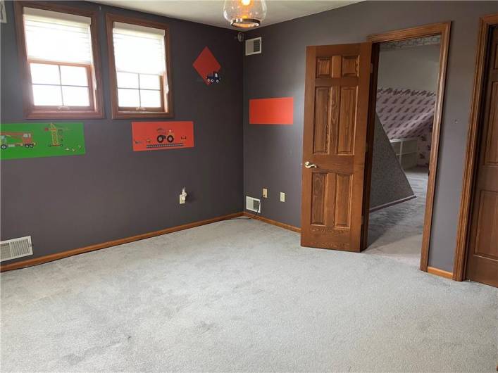 Upstairs bedroom with additional room that has tons of possibilities